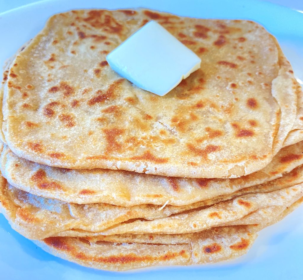 Plain Paratha (Whole wheat flour flatbread) toasted with ghee (clarified butter).